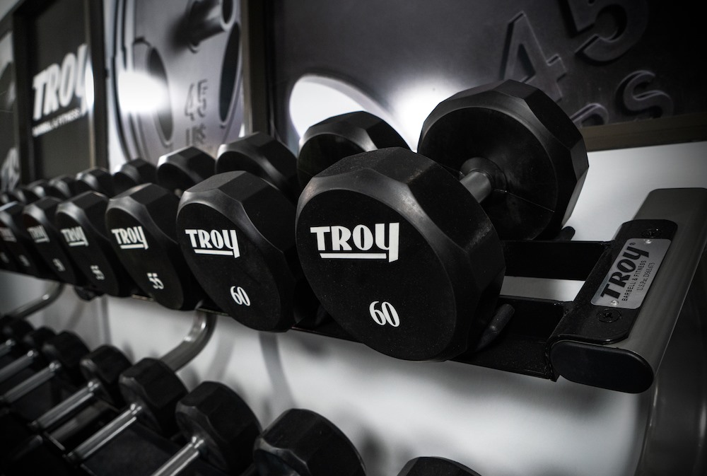 View of Tory Fitness Urethane Dumbbells in a workout room